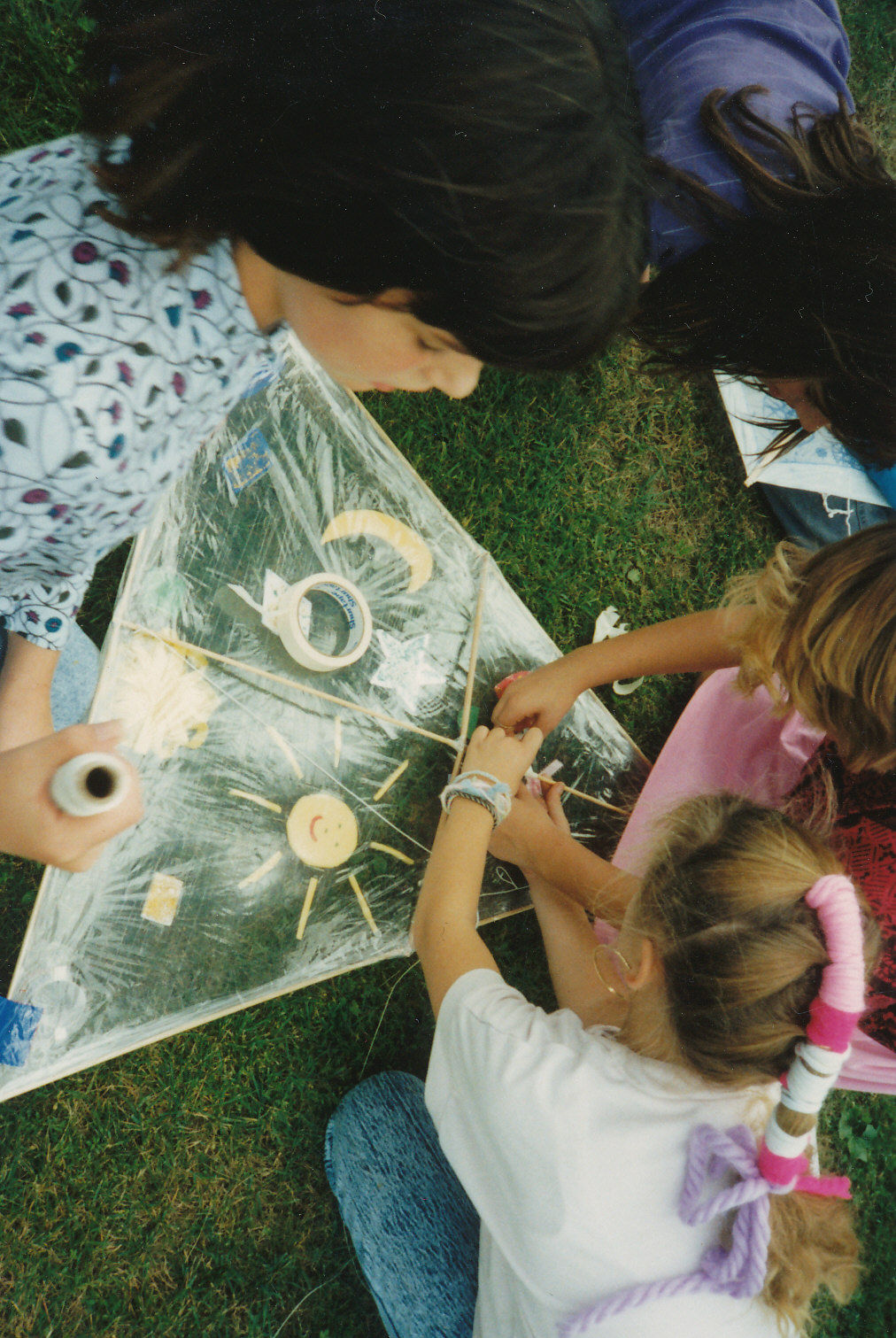 Girl making kite